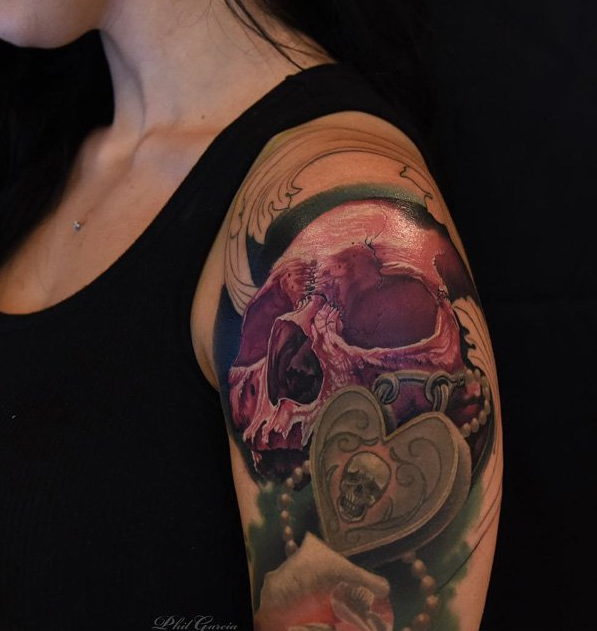 Skull and lock tattoo