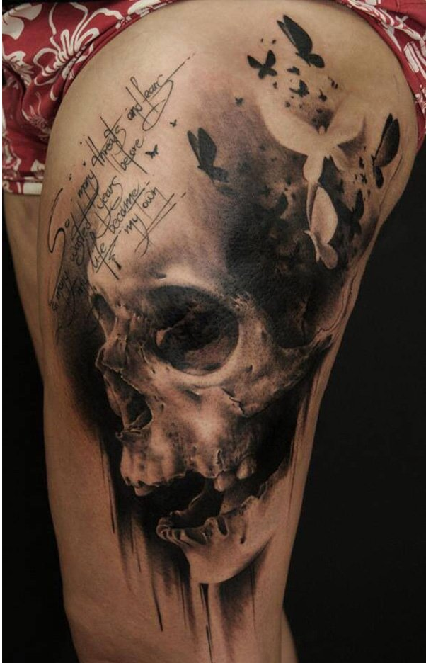 Skull thigh tattoo