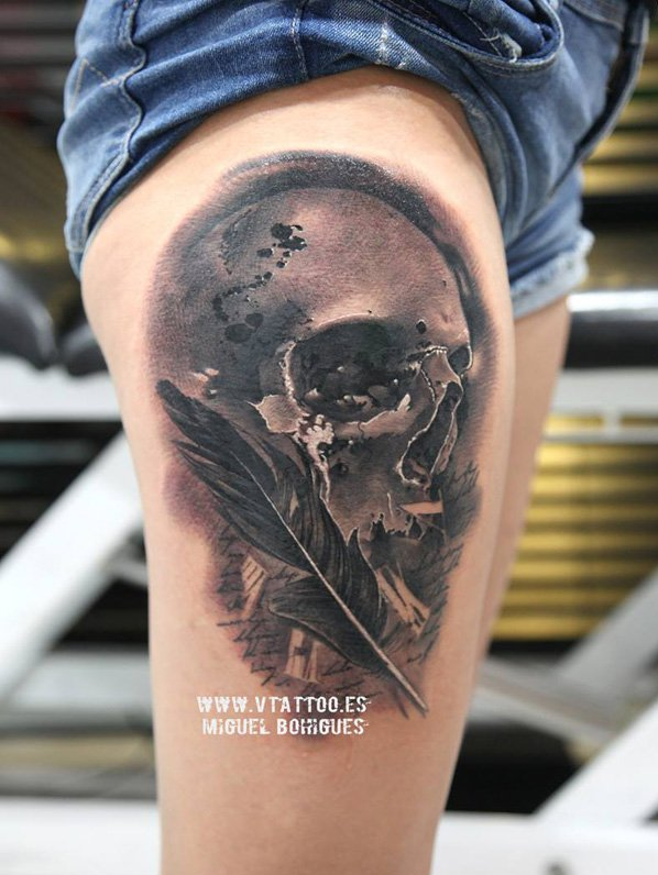 Skull with feather tattoo