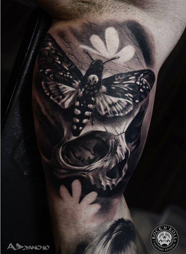 Skull with moths tattoo