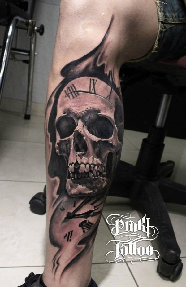 Skull with watch tattoo on leg for men
